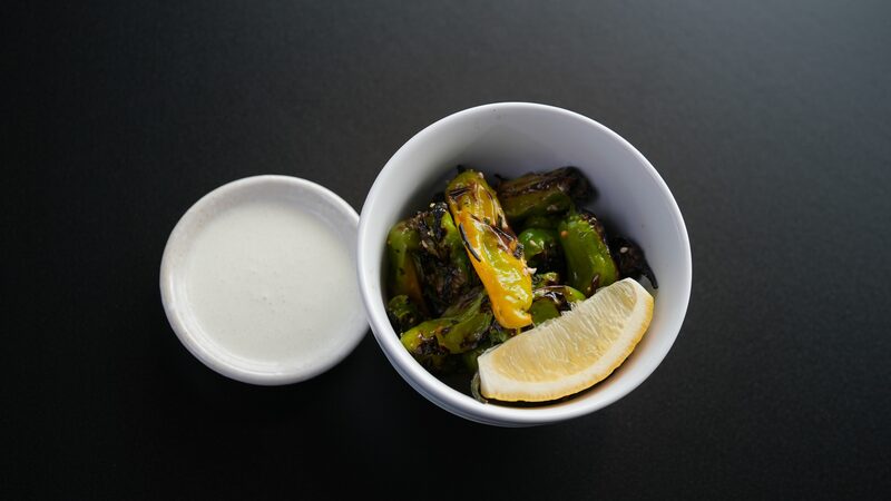 Charred shishito peppers with yuzu aioli
