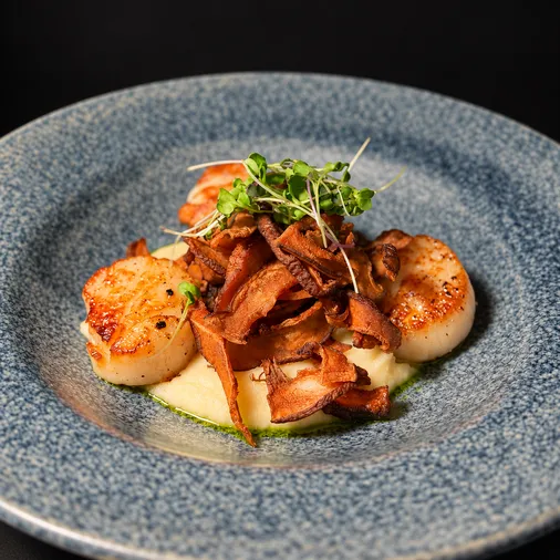 Pan-seared Hokkaido scallops with shiitake mushrooms over celeriac purée