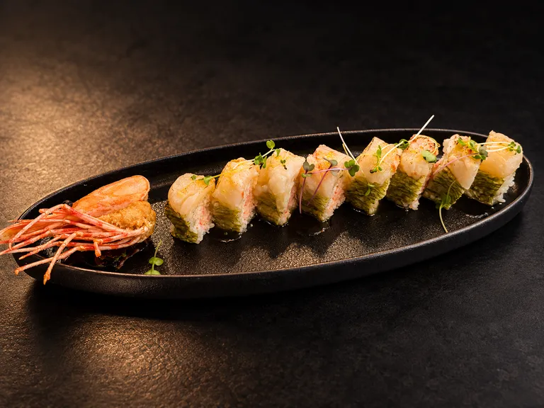Ocean Fusion Maki with scallops and sweet shrimp on a black platter
